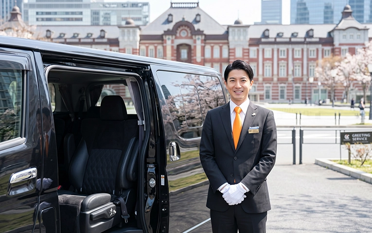 Chauffeur greeting guests at Tokyo Station