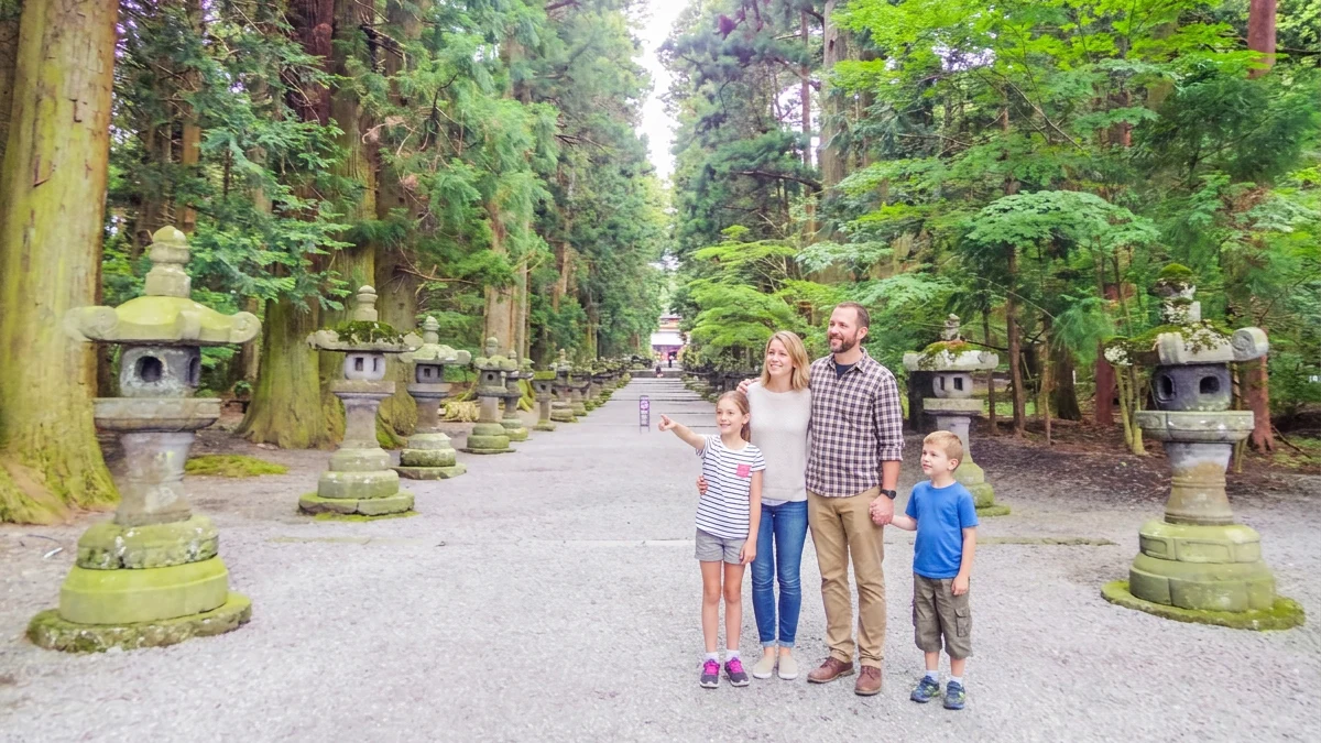 A family walking through nature at Kitaguchi Hongu Fuji Sengen Shrine