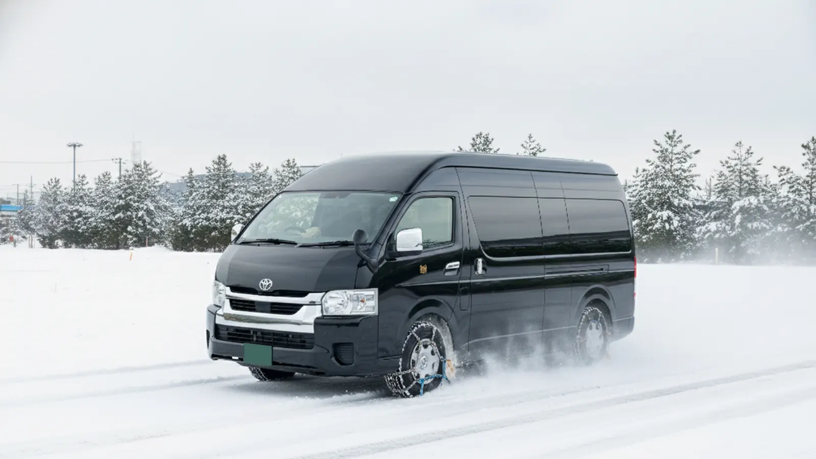 A Hiace with snow chains