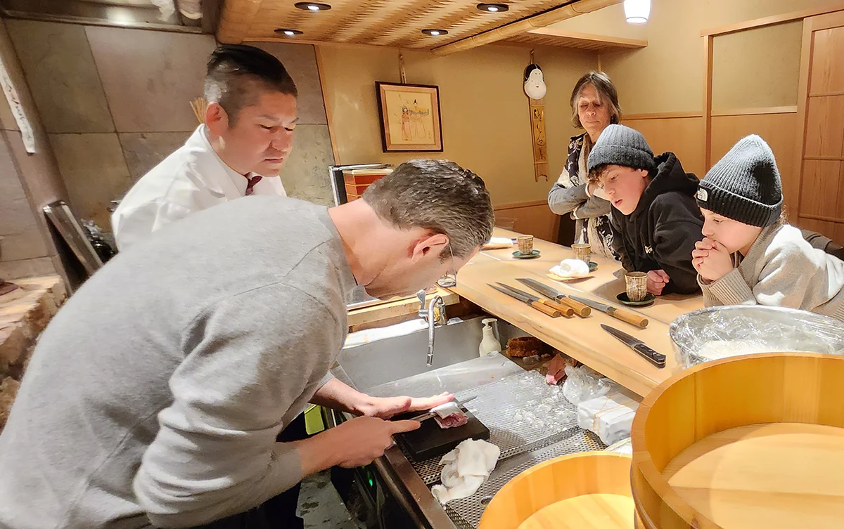Chef teaching knife technique sanmai oroshi
