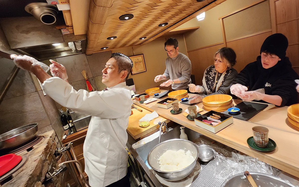 Learning to hand-press 10 to 12 pieces of seasonal nigiri sushi from a master chef